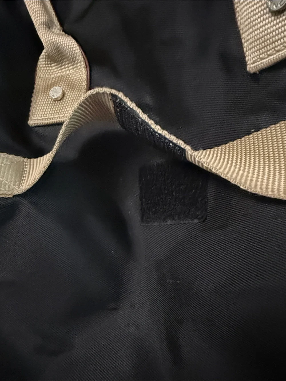 Black Duffel Bag with Tan Handles and Brown Accents
